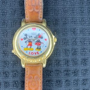 Minnie & Mickey Mouse watch. Will need a new band